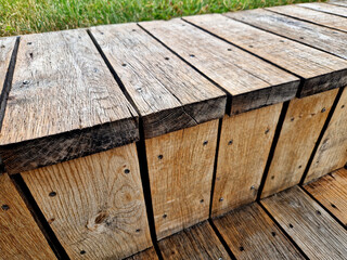 The plank cladding at the terrace forms a step after sitting down like a park bench. oil paint