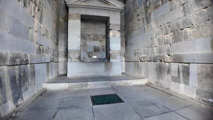 the Cella: the Interior of Garni Temple in Armenia, featuring ancient stone walls, an altar, and a...