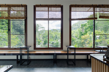 Japanese ryokan style interior with large windows offering rest and relax atmosphere surrounded by...