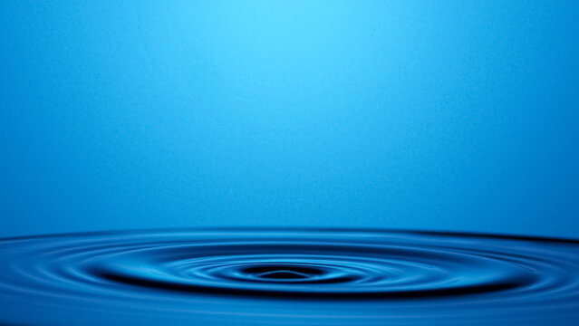 Ripple Effect: Capturing the serene and minimalist beauty of a single water droplet's impact, showcasing the elegant concentric circles that form.