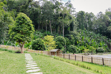 Peaceful ryokan garden in japanese style offers perfect place to rest and relax surrounded by lush...