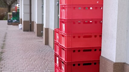 Empty Plastic Food Crates on Loading Ramp Behind Grocery Store