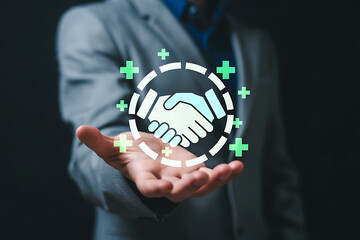 Handshake icon with plus signs representing partnership and growth