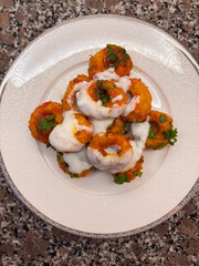 Top-Down Flat Lay of Fellah Köftesi Topped with a Garlic Yogurt Sauce