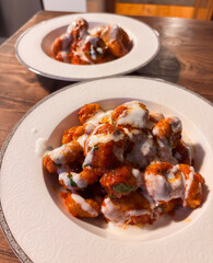 A Shared Meal of Homemade Fellah Köftesi with a Garlic Yogurt Topping