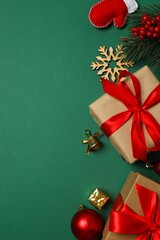 Top vertical view of gift boxes and Christmas decorations on color background 