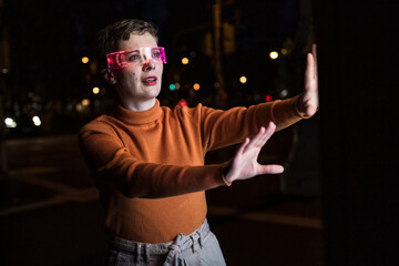 Woman using AR glasses making gestures at city night