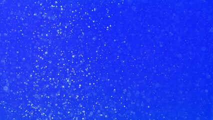 Microscopic air bubbles in blue water background
