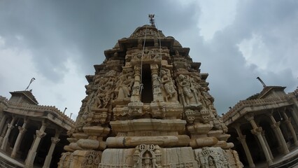 Fototapeta premium Sculpted Carvings and Architectural Details on Jain Temple Wall in Chittorgarh Fort