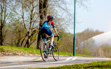 Fototapeta premium Cyclist ride on the bike path in the city Park 