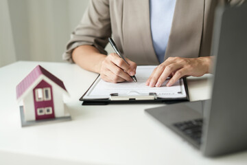cagents working in real estate investment and home insurance signing contracts in accordance with the home buying insurance agreements approving purchases for clients