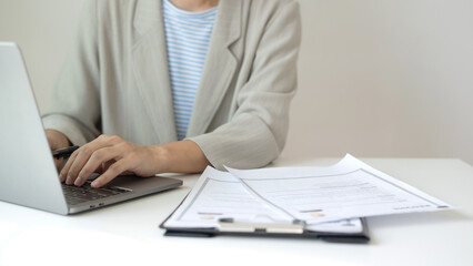 Fototapeta premium Business woman employer holding resume hiring recruit looking cv resume to hire candidates, analyzing information before job interview. Recruitment concepts
