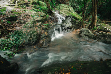 Scenic Waterfall in Lush Green Forest at Jetkot Attraction