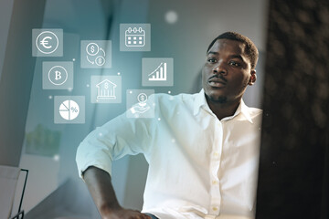 Professional man analyzing financial data and cryptocurrency trends in a modern office setting during daytime