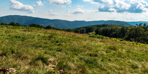 Wild Valcan mountains in Romania with abandoned shelter and hills