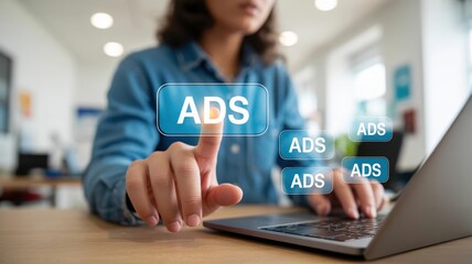 Dynamic Digital Advertising: A person interacting with "ADS" icons on a laptop screen, illustrating targeted online campaigns for effective brand promotion and audience engagement