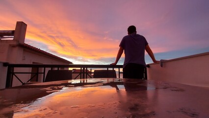 A man standing in plain late afternoon light after the storm 