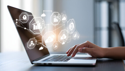 Fingers typing on laptop with digital network icons