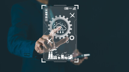 A person interacts with a virtual interface displaying gears and icons, suggesting themes of...