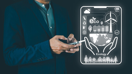 A person in formal attire holds a smartphone displaying ecological themes, including nature,...