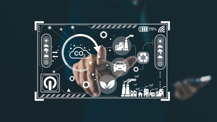 A digital interface displays environmental data, including CO2 levels and sustainability icons, while a person interacts with it using a finger.