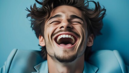 Heartfelt Laughter: Expressive Man Bursting with Joy on a Blue Background
