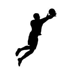 Soccer player reaching for the ball in silhouette.