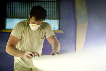 Workshop, man and tools with surfboard for shape, manufacturing and creativity for handmade design....