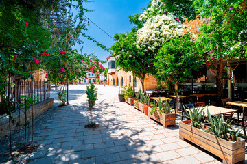 Outdoor restaurants and cafes on a sunny day on a street in the Turkish part of Nicosia, Cyprus. Street life in Cyprus.