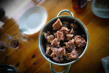 Barbecue meat kebab with onions and tomatoes. View from above. Rustic style.