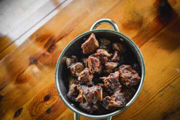 Barbecue meat kebab with onions and tomatoes. View from above. Rustic style.