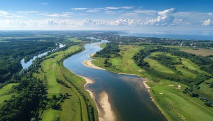 Obraz premium Scenic river winding through green landscape