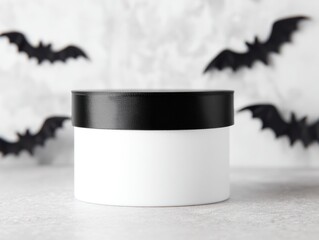 Clean Halloween themed packaging label mockup with white container and black bats for design presentation