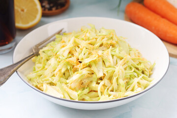 A bowl with coleslow salad	