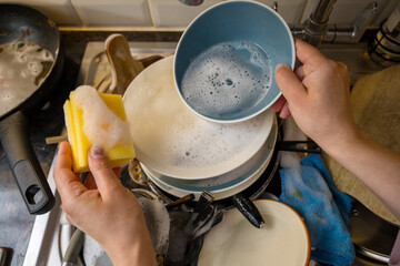 Closeup scene of washing dishes in kitchen, the mindful chore