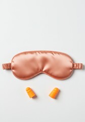 Sleep Accessories: Silk Eye Mask and Earplugs on White Background