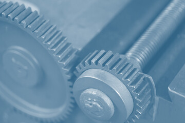 Gear industry background, Mechanical cog wheel in machine, Heavy industry machinery blue color tone