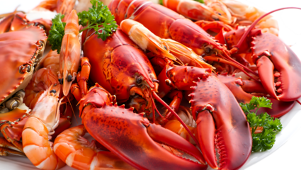 A generous platter overflowing with vibrant red lobsters succulent shrimp and other delicious seafood artfully garnished with fresh green parsley for a visually appealing presentation