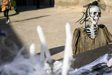 A Macabre Scene with a Skeleton and Candles. Concept Creating a haunted atmosphere.