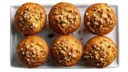 A delicious plate of nut-topped muffins, perfect for breakfast or snacks, isolated on white background.