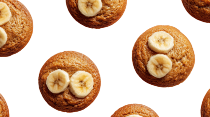 Delicious banana muffins with slices of banana on top, isolated on a white background.
