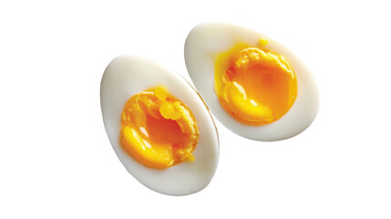 Two perfectly cooked soft-boiled eggs with vibrant yolks, isolated on a white background.