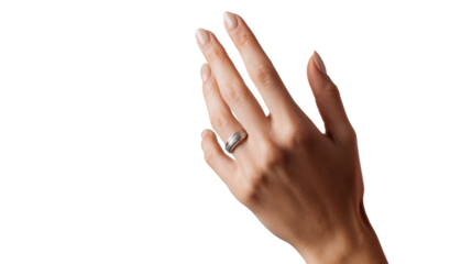 A hand displaying a silver ring against a white isolated background.
