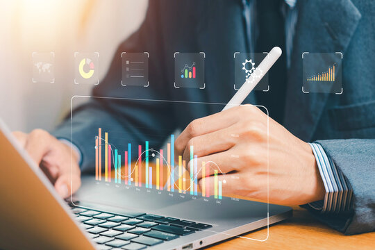 Financial business KPI System data analytics graph dashboard. Businessman using laptop and dashboard for business data analysis and data management system with KPI. operations, sales, marketing