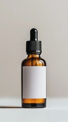 Amber glass dropper bottle with a white label on a neutral background