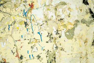  Abstract: crumbling graffiti on a city street wall. Colorful abstract background. Old, cracked,...