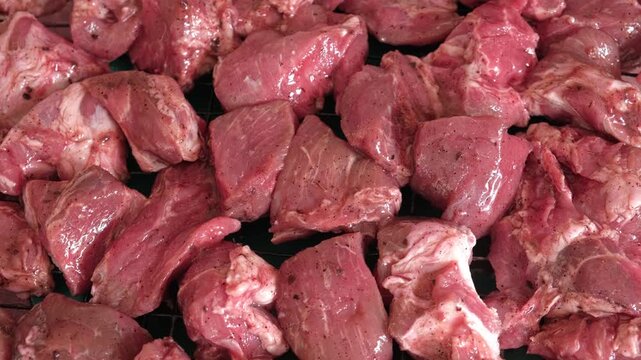 Raw sliced pork in sauce. Pieces of fresh marinated pork medallions. Freshly meat tenderloin, perfect for culinary, home cooked meals and flavor. Chopped Pork ham fillet with spice, herbs. 4K video