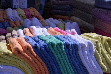 Lots of colorful new towels at the market stall