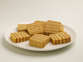 Layer cake, sliced, isolated on white background