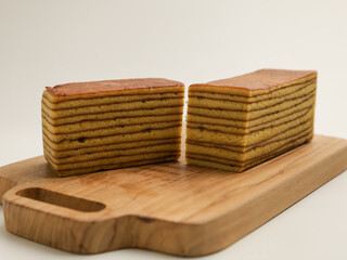 Layer cake, sliced, isolated on white background